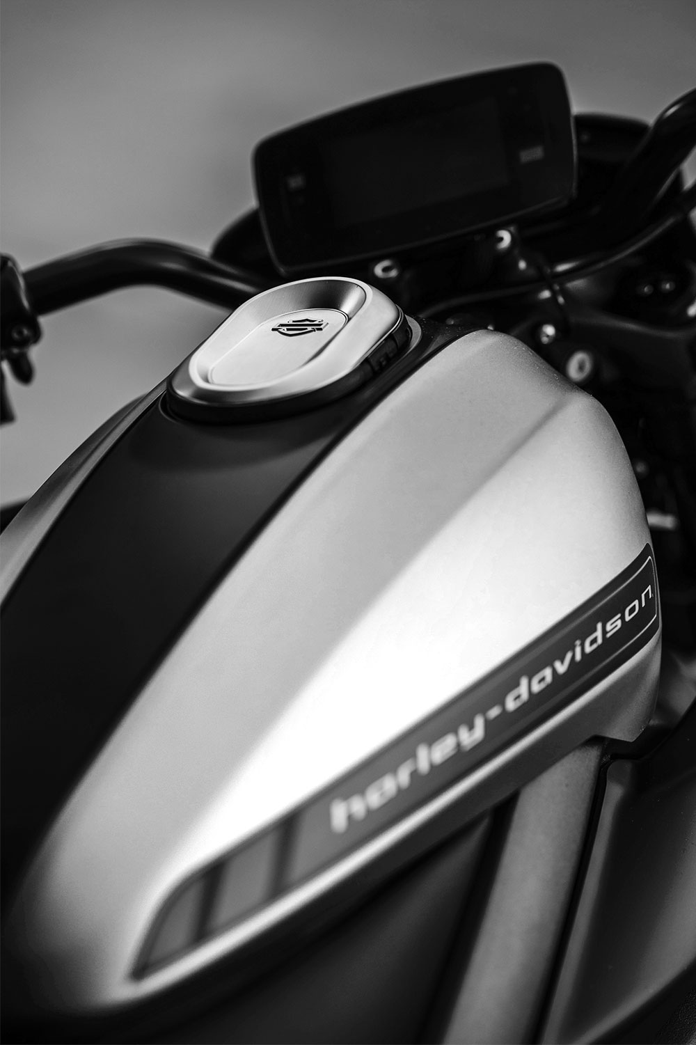 A close up of the tank on a harley davidson motorcycle.